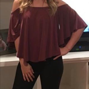 Flowery shirt off the shoulder